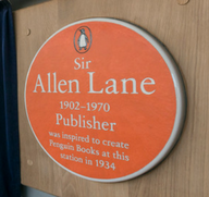 Sir Allen Lane honoured with orange plaque at Exeter railway station