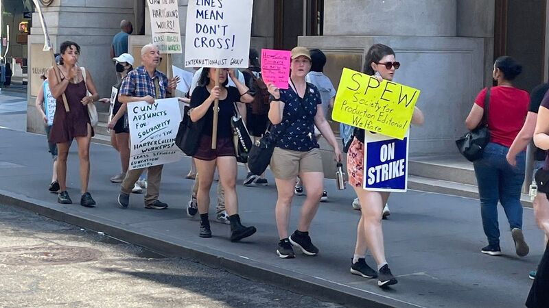 HarperCollins US staff strike outside publisher's offices demanding better pay and benefits