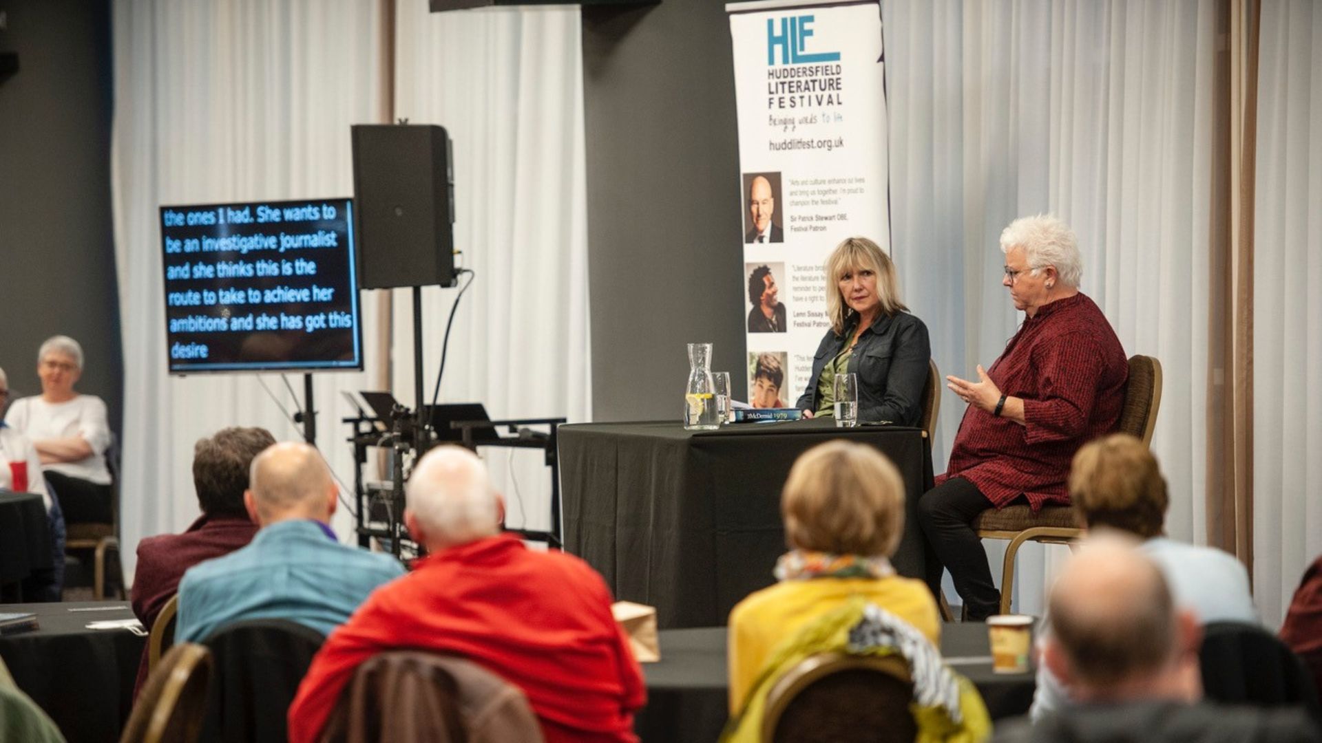 Val McDermid in conversation at Huddersfield Literature Festival 2021. The event had live subtitling