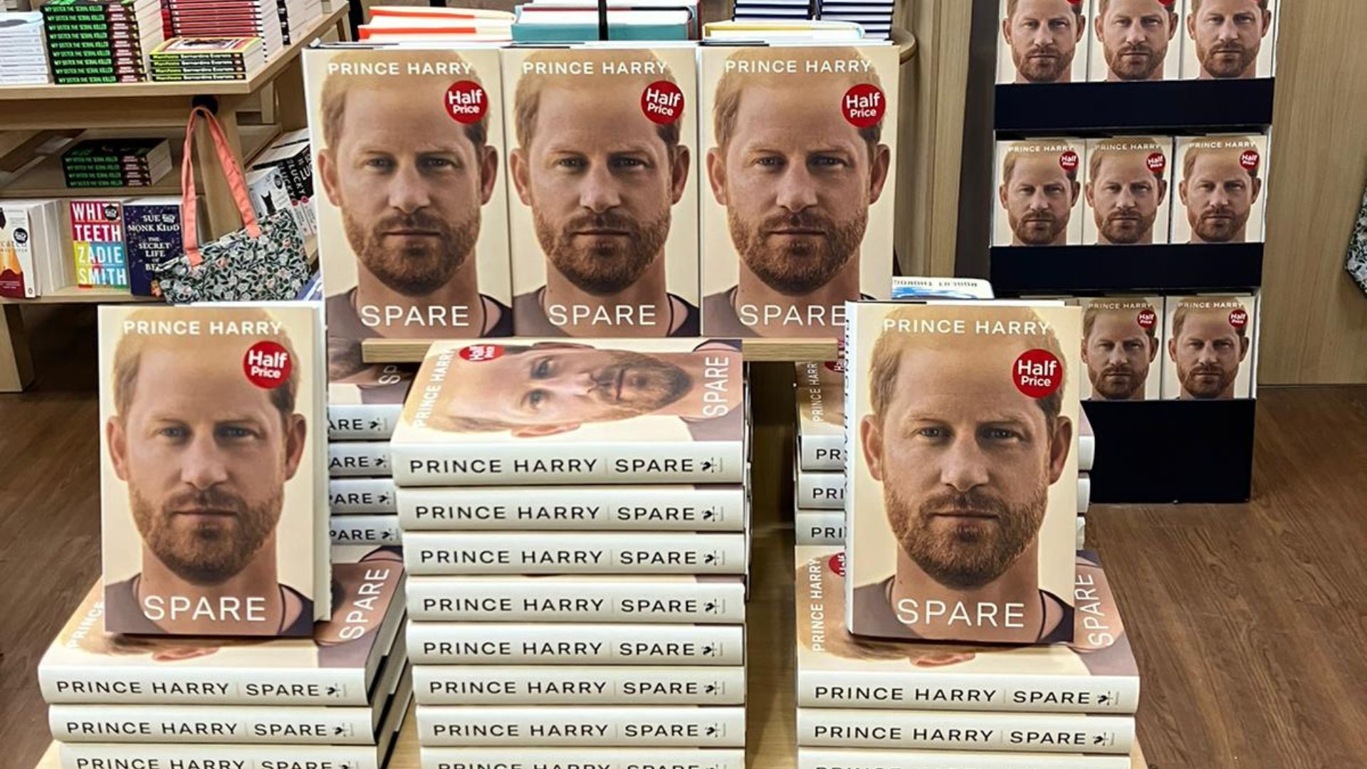 W H Smith shared photos of tables and displays stacked with copies of Prince Harry's memoir