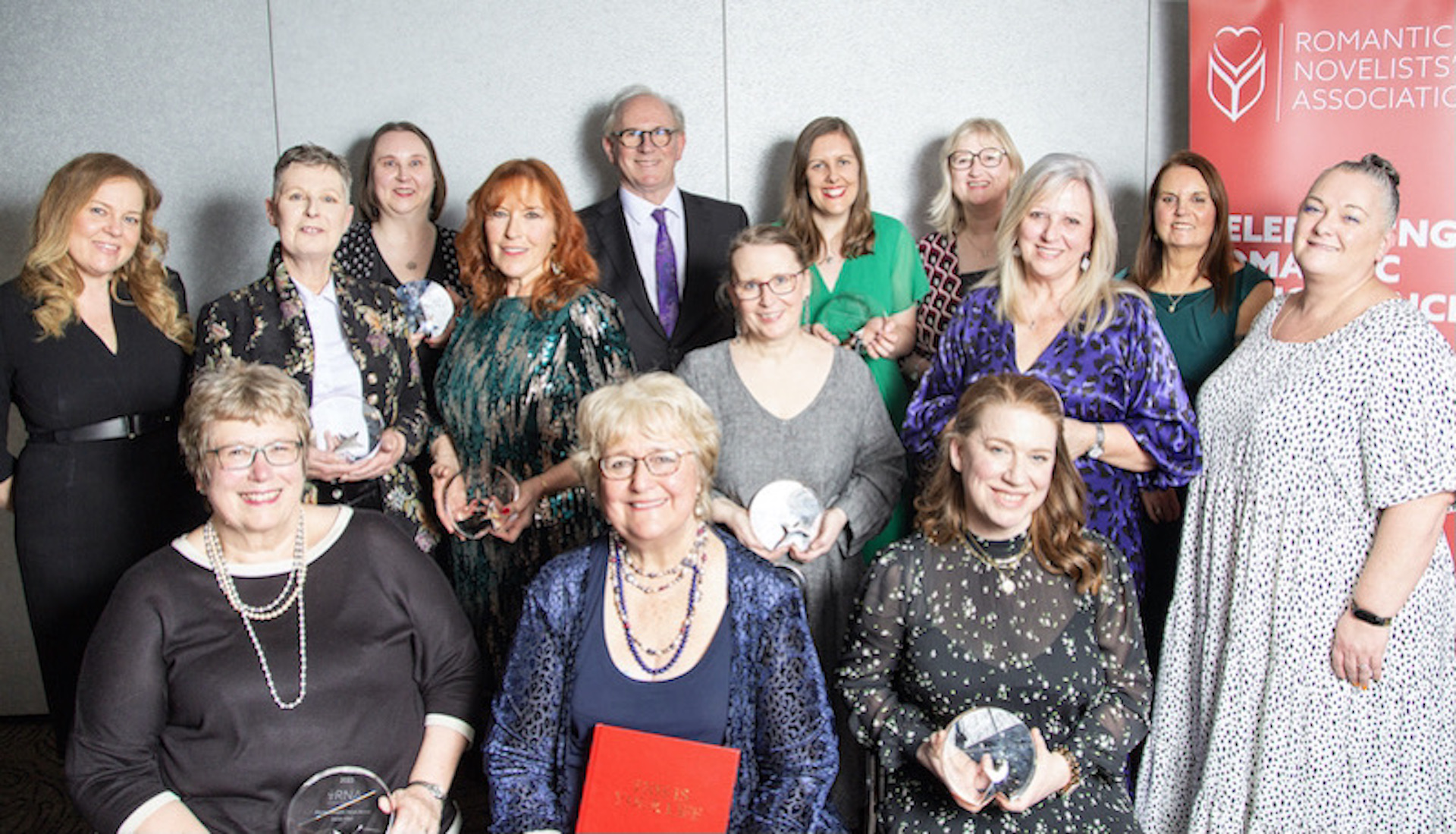 RNA Romantic Novel Awards 2023 winners, with RNA Chair, RNA awards organiser, awards sponsors (including Katie Fforde) and presenters. Photo credit: Camilo Queipo Photography