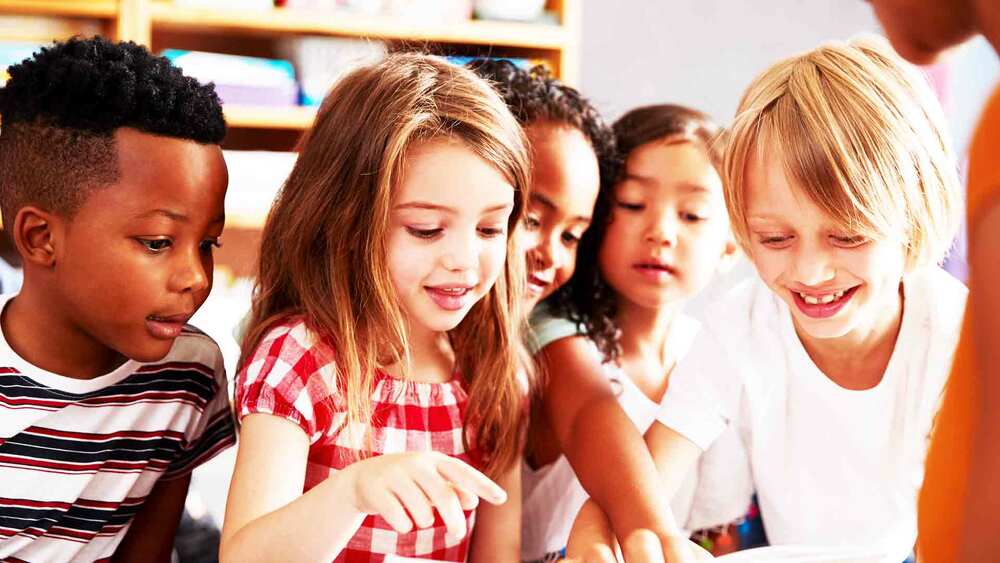 Children reading, group, generic &copy; Shutterstock