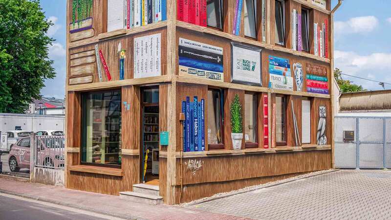 Tiny bookshop painted to look like bookshelves takes German town by storm