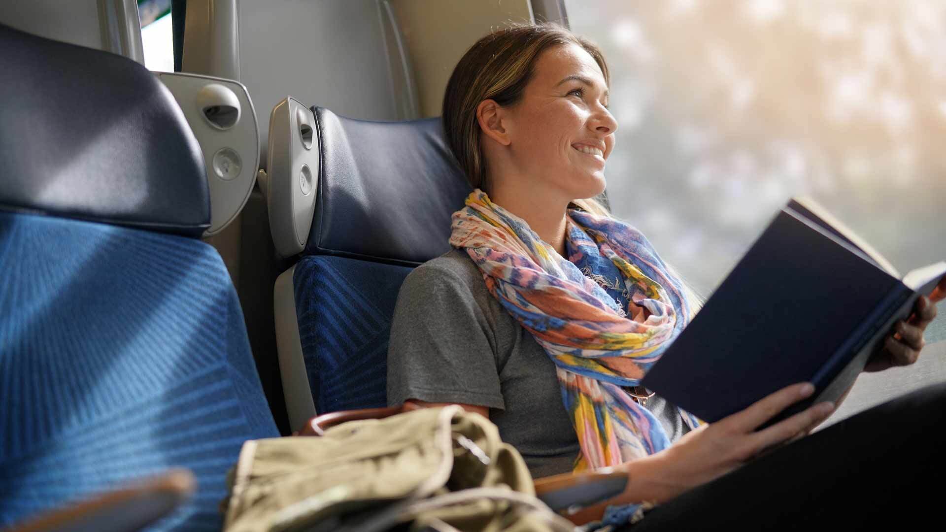 Woman reading on train c shutterstock