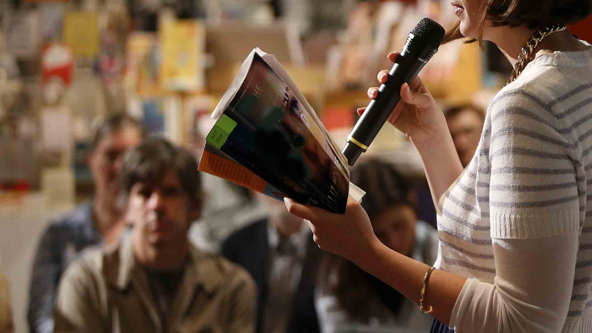 Woman reading from book &copy; Shutterstock
