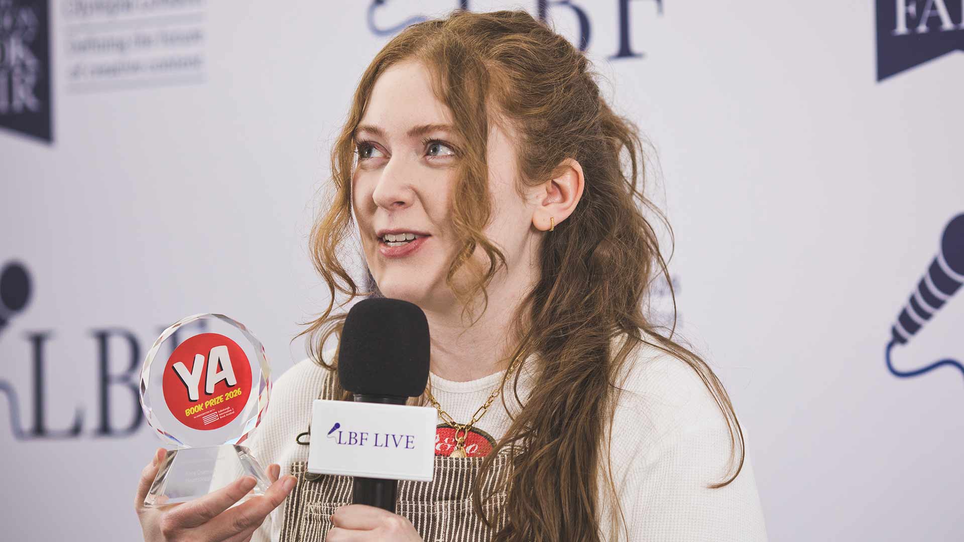 Alice Oseman receives the YA Book Prize Special Achievement Award at the London Book Fair 2026 © Asun Olivan Alice Oseman receives the YA Book Prize Special Achievement Award at the London Book Fair 2026 © Asun Olivan