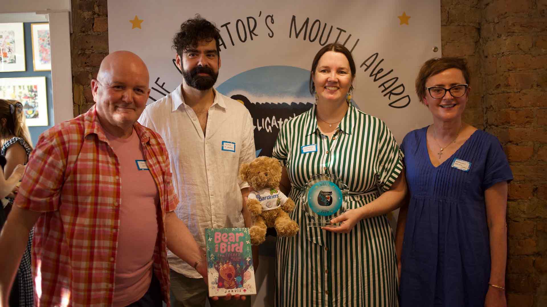 L-R: Tony West (co owner of The Alligator's Mouth), Thiago de Moraes (judge), Shannon Cullen (publishing director at Walker Books, Cullen accepted the award on Jarvis behalf) and Margaret Wallace-Jones (co owner of the Alligators Mouth)